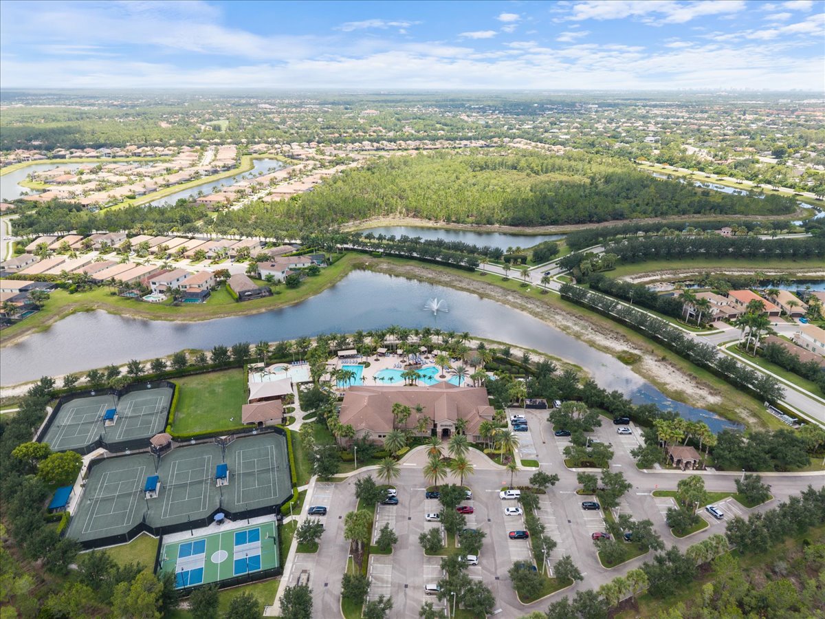 Aerial view of community pool and tennis courts