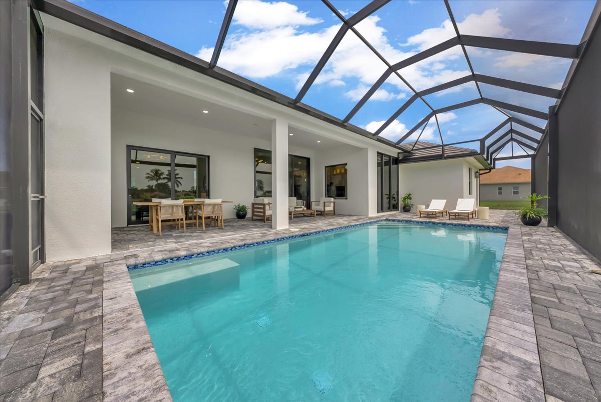 Screened pool and covered lanai at 18018 Greenwood Drive, Naples, listed and sold by The Philly Rodriguez Group