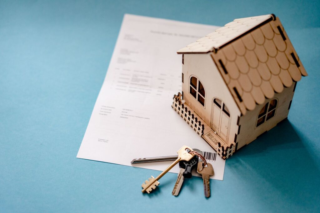 House keys and purchase paperwork representing the closing process on a Naples home