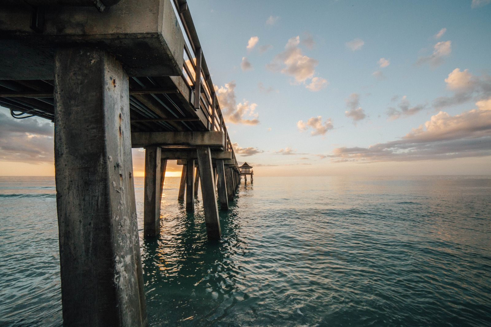 The Naples Pier at sunset over the Gulf of Mexico, at the end of 12th Avenue South in Olde Naples